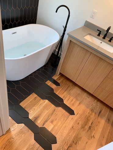 Plumbing Services - New tub and sink with vanity