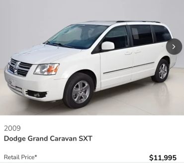 2009 white Dodge Grand Caravan SXT minivan.