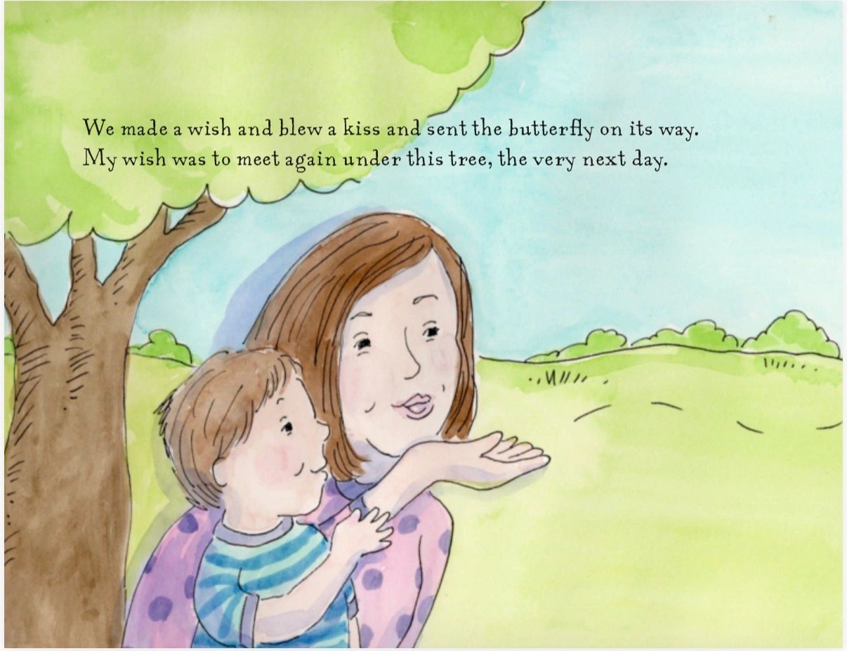 A woman and child make a wish under a tree on a sunny day.