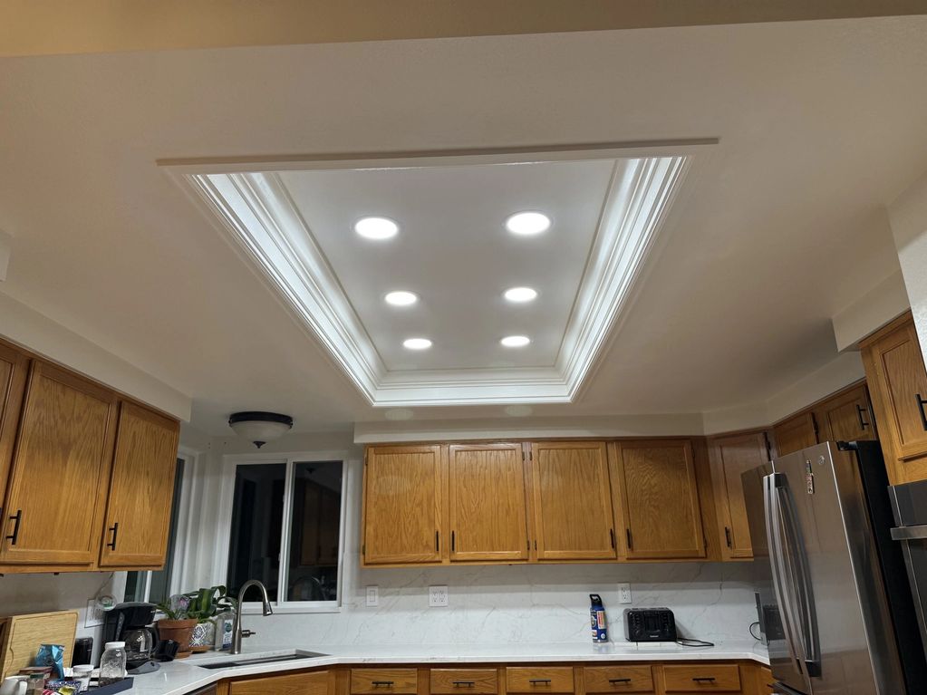 Finished kitchen ceiling with recessed lighting