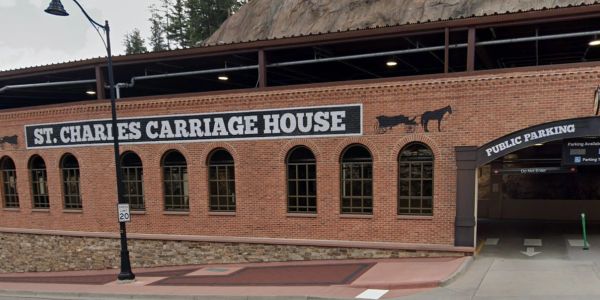 St. Charles Carriage House building with public parking.