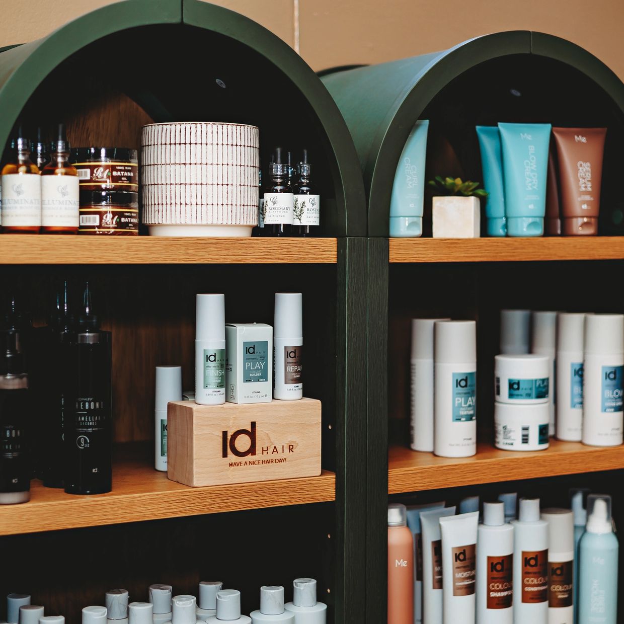 Shelves displaying various hair care products, including id HAIR brand.
