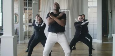 Tituss Burgess and Dance Ensemble performing in the music video for "45"