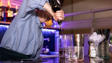 bartender pouring a cocktail 