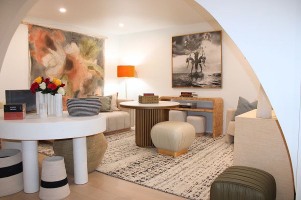 Modern living room with artistic decor and cozy seating.