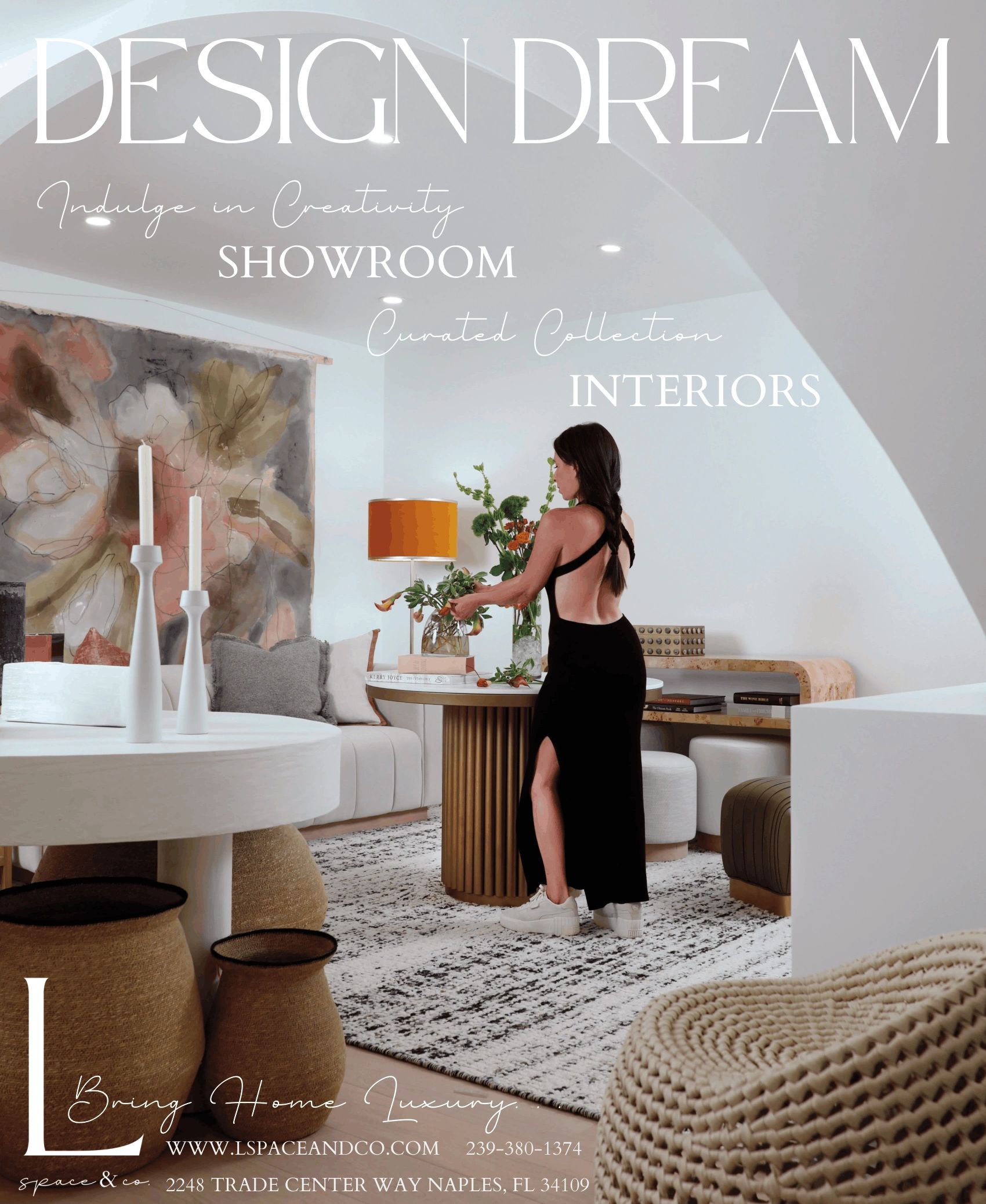 Elegant interior showroom featuring modern furniture and a woman arranging flowers.