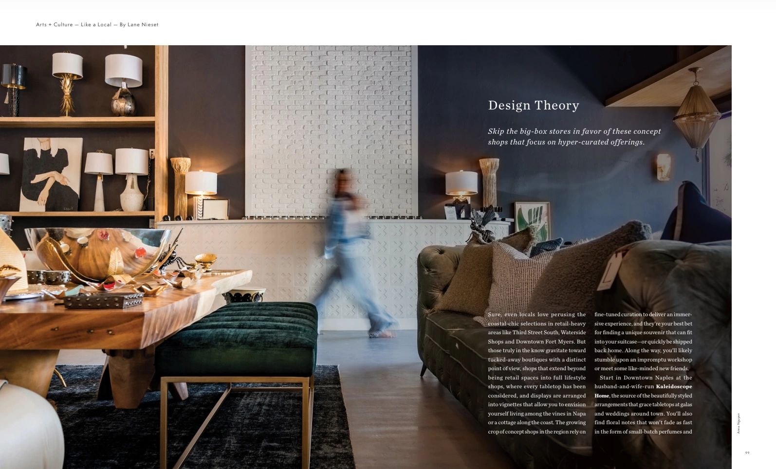 A stylish interior with modern furniture and a blurred figure walking by.