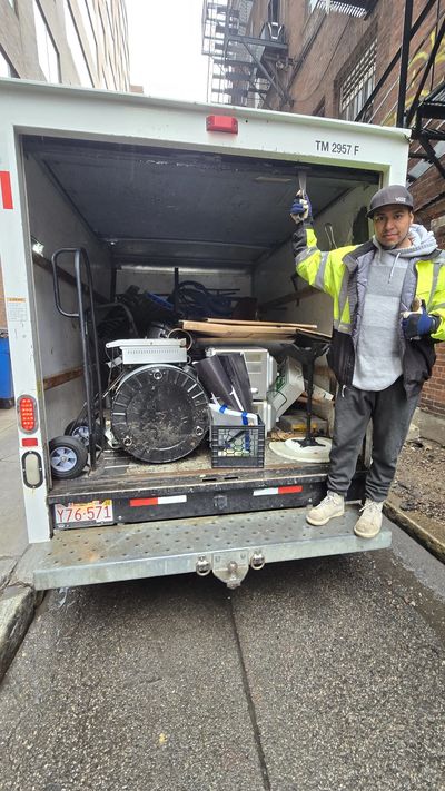 Marvin Junk Removal crew standing in front of their junk removal truck in Lexington, MA,