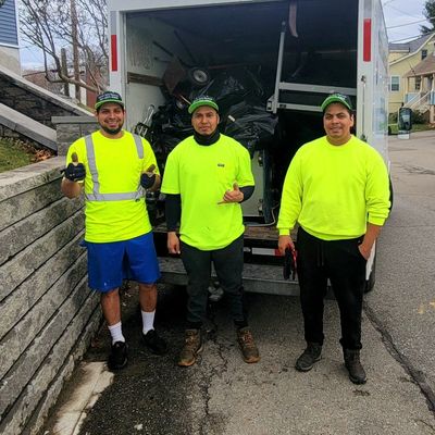 Marvin Junk Removal crew standing in front of their truck in Everett, MA same-day junk removal