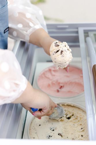 Sweet Maggie’s Ice Cream Cart. Cookies & Cream Ice Cream being scooped into a waffle cone.