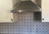 Updated tile backsplash and range hood.