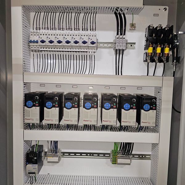 Electrical control panel with PowerFlex drives and circuit breakers.