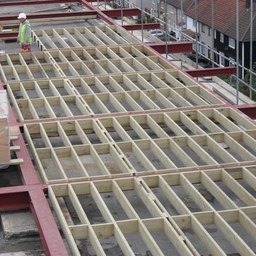 Large structural steel lattice and timber floor. Roof extension Spectrum Building.
