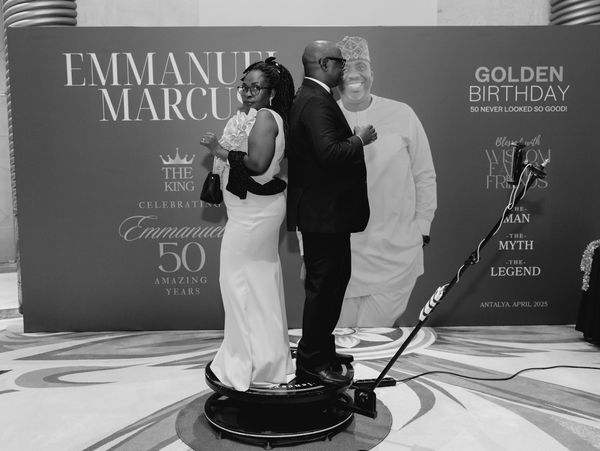Golden 50th Birthday, guests posing in front of a giant backdrop, Antalya