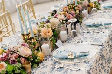 Elegant floral and candlelit table setting for a special event. 