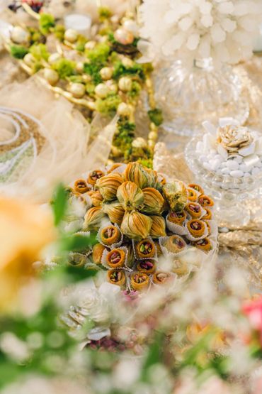 A beautiful arrangement of pistachio-filled Middle Eastern pastries on an ornate table. 