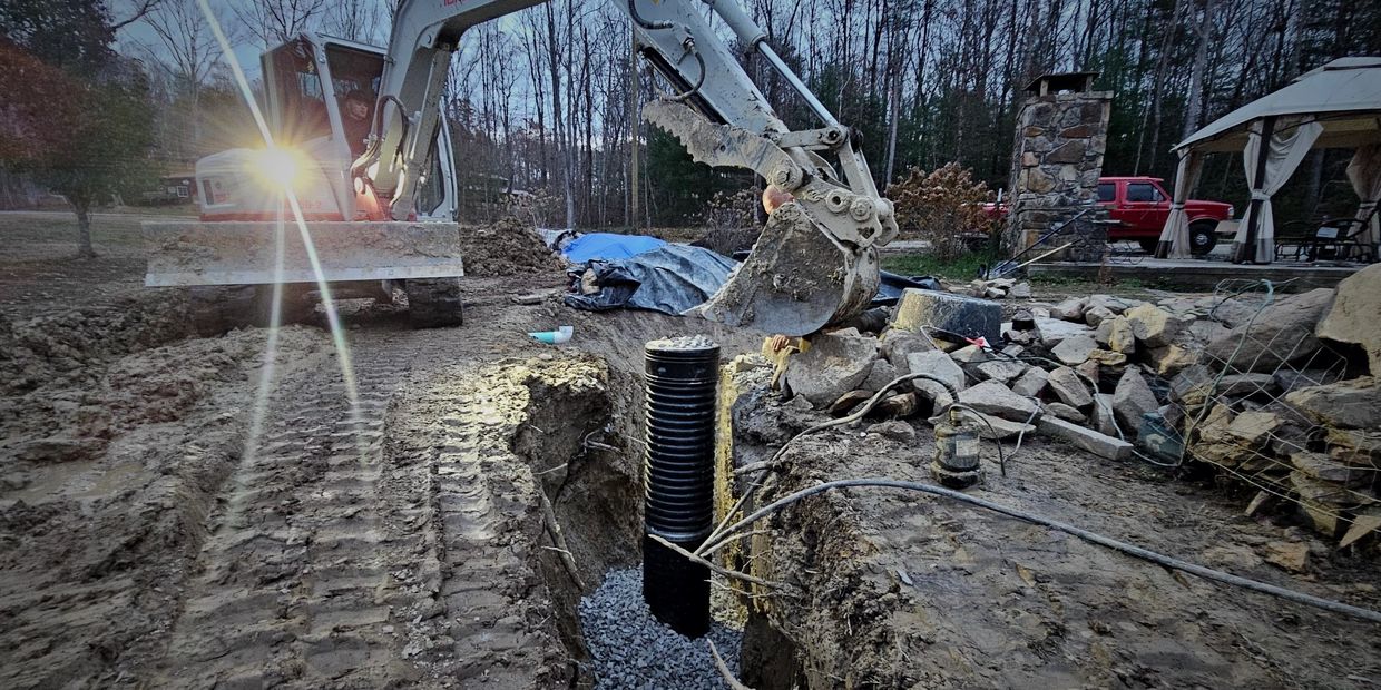Gifted Hands crew installing a pump housing pipe for a pond build. 