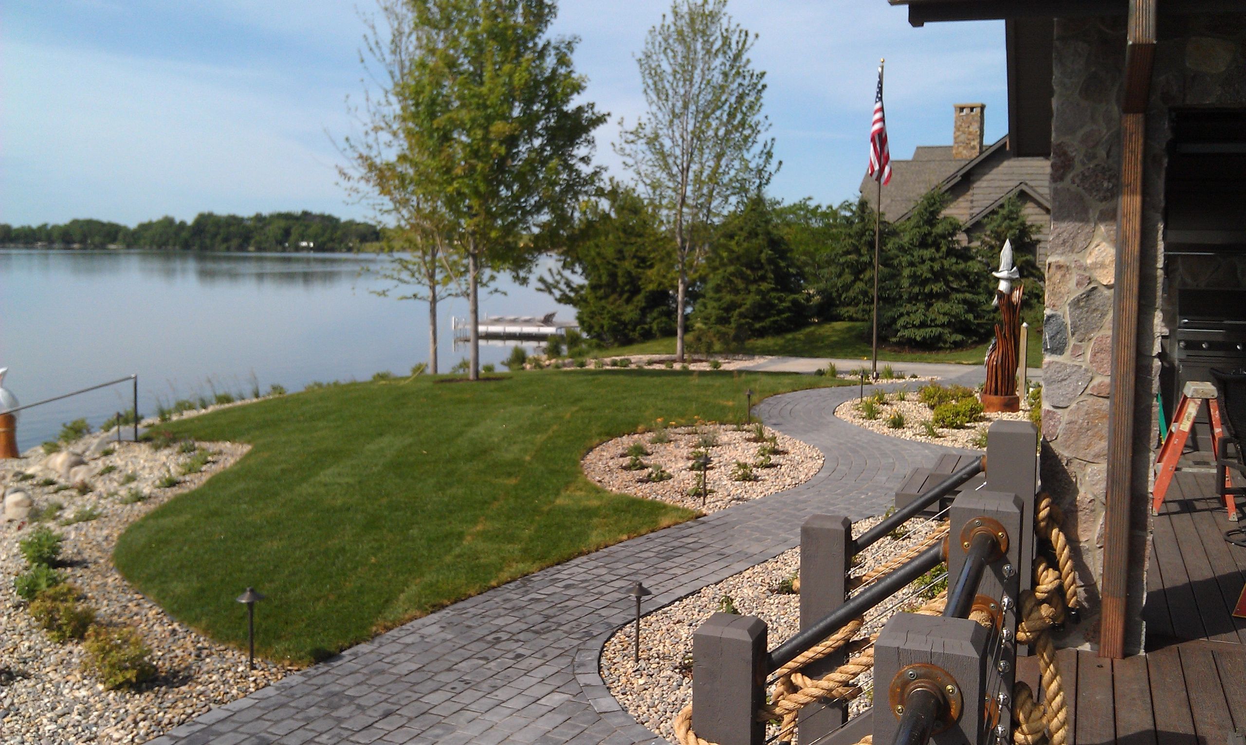 Sioux Falls Landscaping Contractor Paver Walkway Beneath Deck