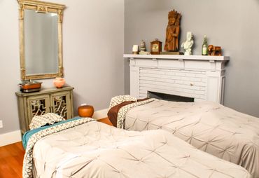 Treatment room with two tables and fireplace