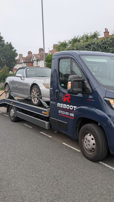 Re-Boot Automotive transporting a Honda S2000 on our single car transport