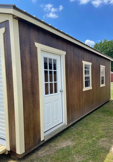 This gable garage is available to tour on our lot. The siding color is chestnut, the trim color is m