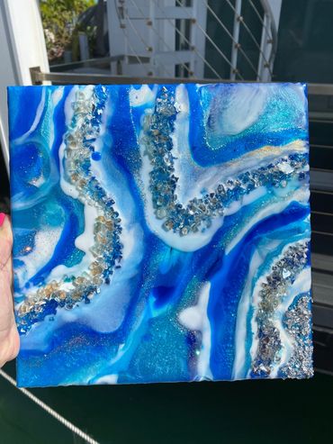 Blue Envy 12 x  12  tumbled quartz crystals, crushed glass, and epoxy on canvas.