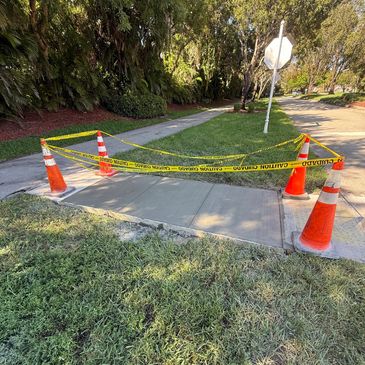 Freshly poured concrete sidewalk repair