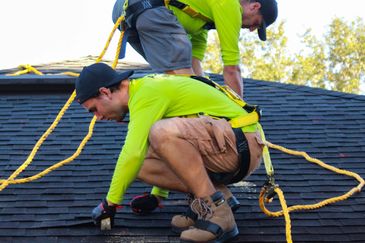 This image is about a Group of roofers at work.