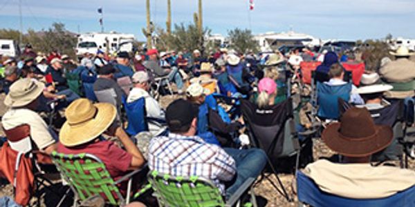 Quartzfest attendees gather at the campfire for the 1600 social hour and more presentations