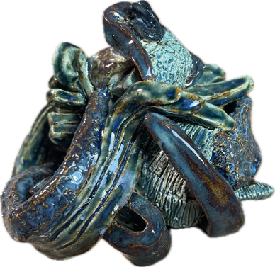 Abstract ceramic sculpture with blue and green glossy tentacle-like forms.
