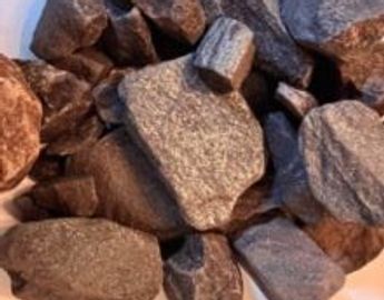 Close-up of irregularly shaped brown and gray rocks piled together.
