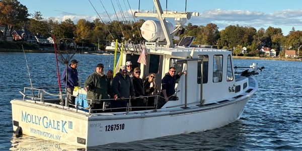 Group of people enjoying a boat ride on Molly Gale K in Huntington, NY.