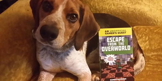 My blue tick beagle Porthos with my first published book. 