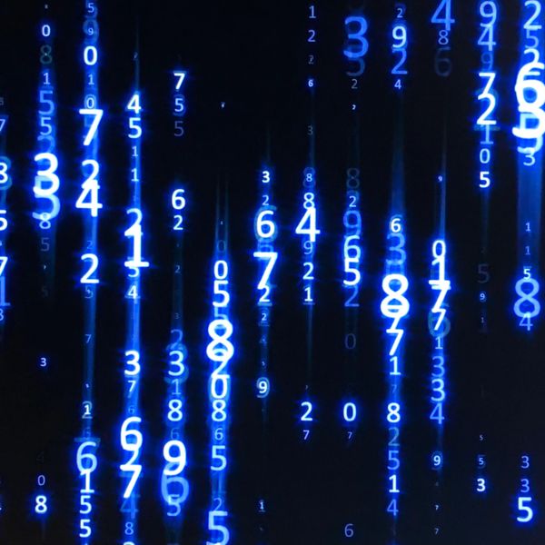 Blue glowing numbers falling vertically on a black background, resembling digital rain.