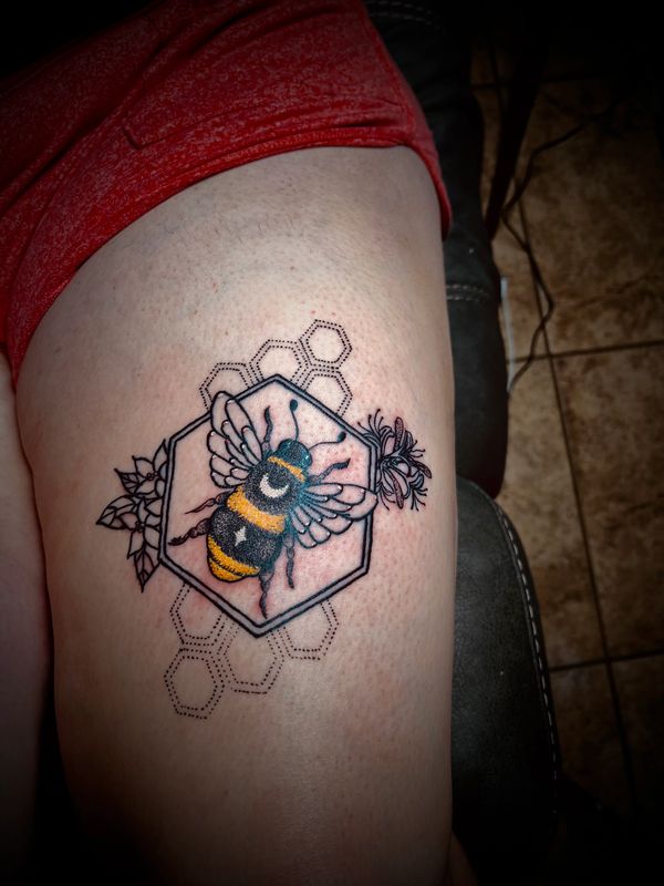 Bumble bee tattoo with geometric shapes.