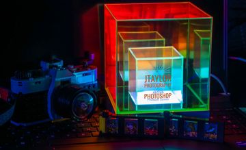 A camera with a light-up cube, Product Photography