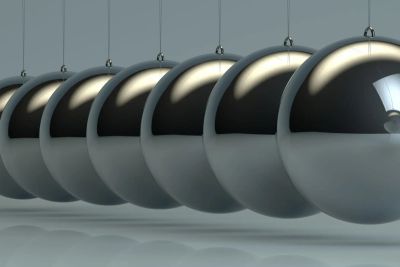 Close-up of Newton's cradle balls in motion.