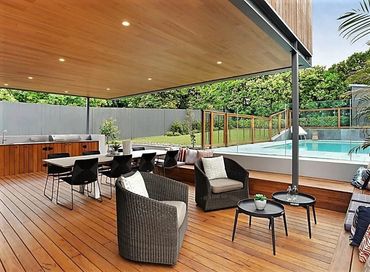 modern outdoor al fresco with built-in seating and kitchen