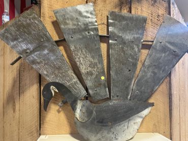 Metal turkey wall decor with rustic wood background.
