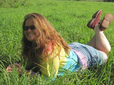 closeup shot of Alison on lying on the grass 
