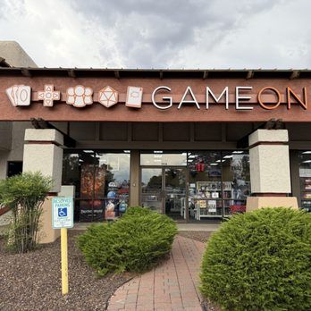 Storefront of Game On, a gaming and hobby shop with unique signage.