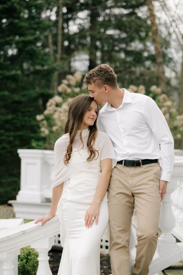 Couple sharing a tender moment outdoors.