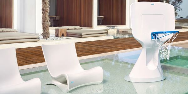 Elegant white pool chairs in water next to white basketball hoop
