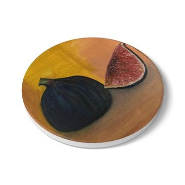 Round coaster featuring a painting of a whole and halved fig on a warm brown background.