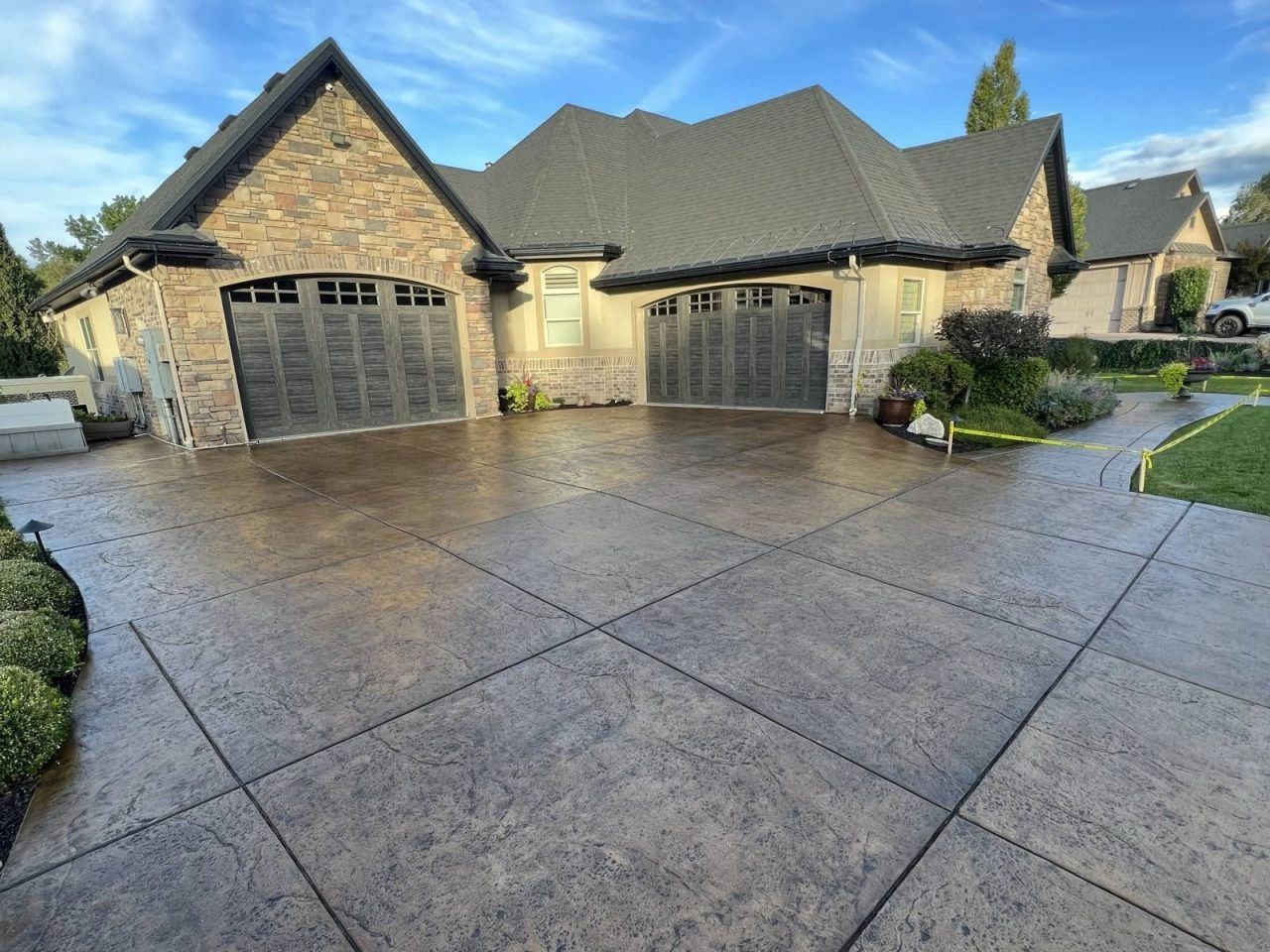 Professional concrete with stamped design in Thornton Colorado. Beautiful new concrete driveway 