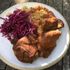 Tender chicken ribs paired with crunchy red cabbage slaw and a serving of fluffy rice for a balanced BBQ-inspired meal.