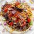 elicious chicken rib taco with smoky meat, served with vibrant toppings on a warm tortilla, perfect for a fusion BBQ dish