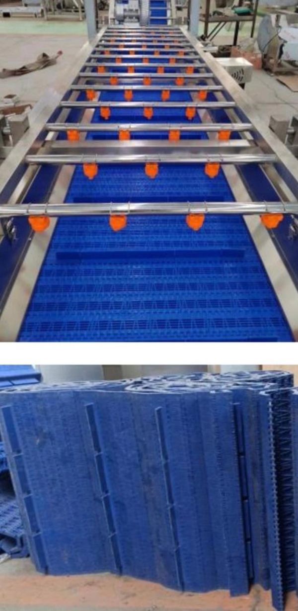 Blue conveyor belts with metal rods and orange nozzles.