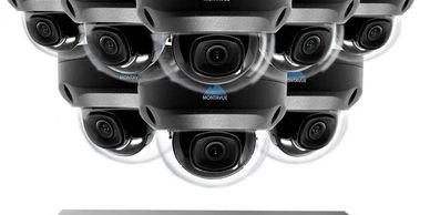 Array of black security cameras with wide-angle lenses clustered together.