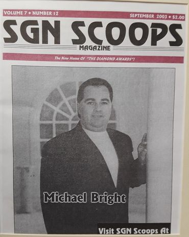 Michael Bright featured on SGN Scoops Magazine cover, September 2003.